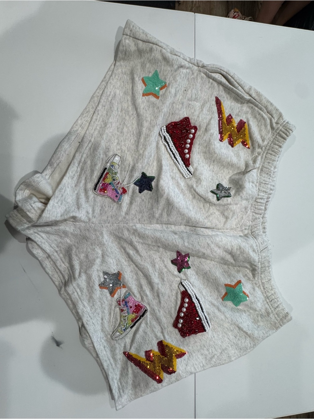 QUEEN OF SPARKLES Cream Athletic Shorts with Multicolor Sequin Patches